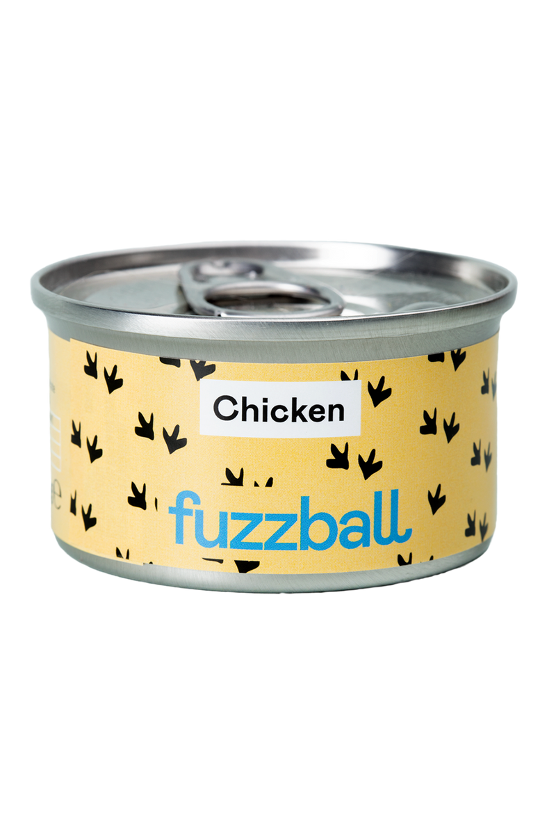 A can of Fuzzball cat food with a yellow label featuring black silhouette illustrations of chicken and the brand name.