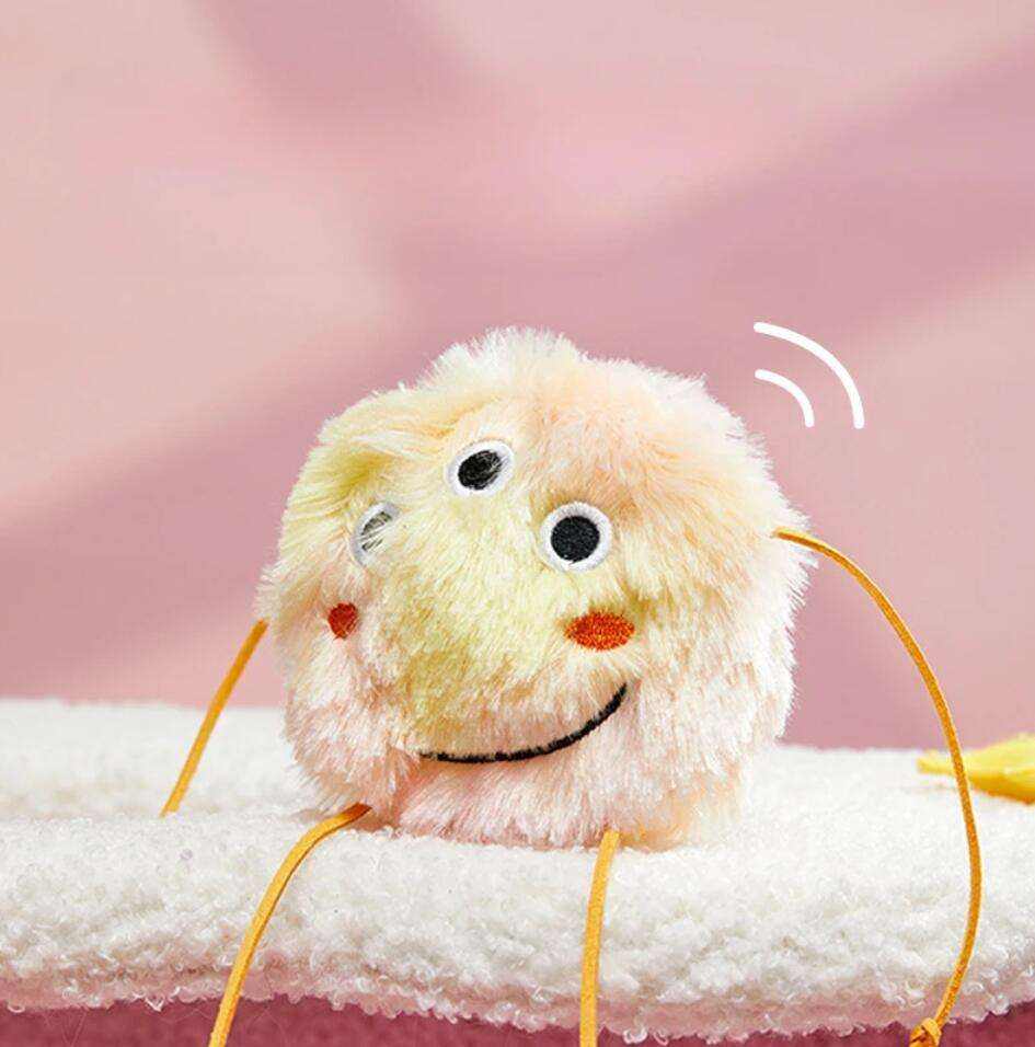 cute yellow and orange fuzzling cat toy